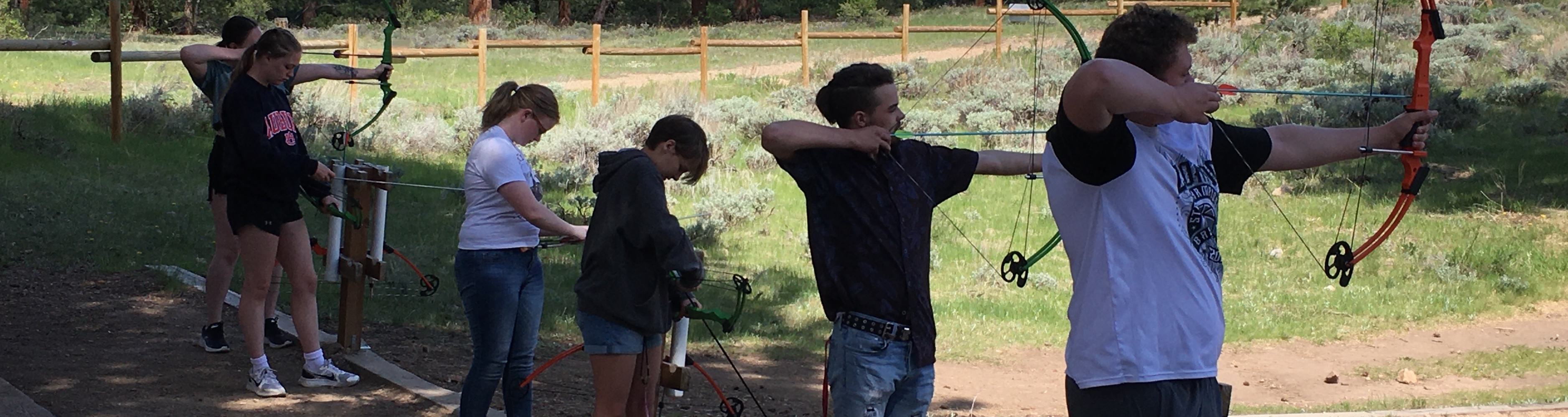 Gifted students learning archery